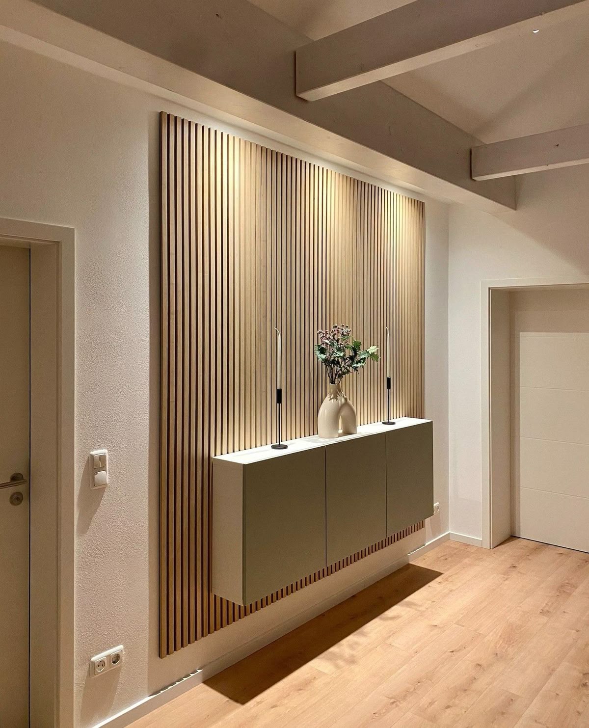 Decorative wall panel installation with slatted texture, lighting, and console detail